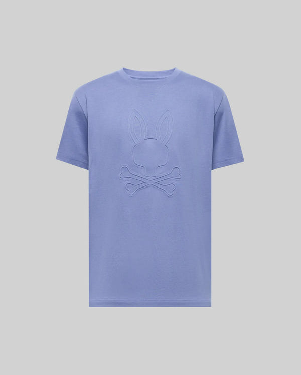 The Psycho Bunny MENS REMY GRAPHIC TEE (MT0200059) in light purple is made from soft Pima cotton and features an embossed bunny with crossbones logo on the front, shown against a plain light background.