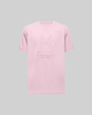 The Psycho Bunny MENS REMY GRAPHIC TEE (MT0200059) is a light pink Pima cotton shirt featuring an embossed bunny logo above crossed bones, shown on a plain gray background.