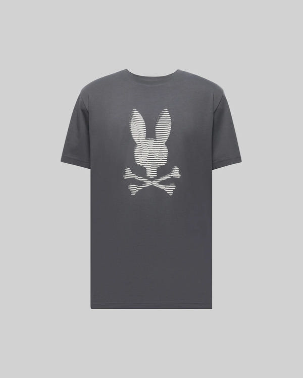 The Psycho Bunny MENS GRANT BUNNY GRAPHIC TEE (MT0200081) is a dark gray Pima cotton tee featuring a white bunny head above crossed bones, creating a playful skull and crossbones design centered on the chest.