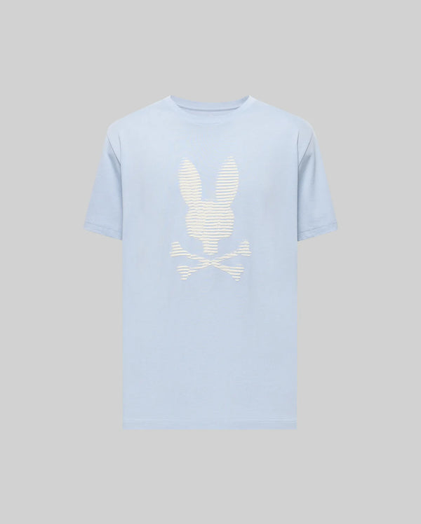The Psycho Bunny MENS GRANT BUNNY GRAPHIC TEE (MT0200081) features a light blue Pima cotton build with a bold white bunny head over crossed bones graphic on the chest, set against a plain grey background.