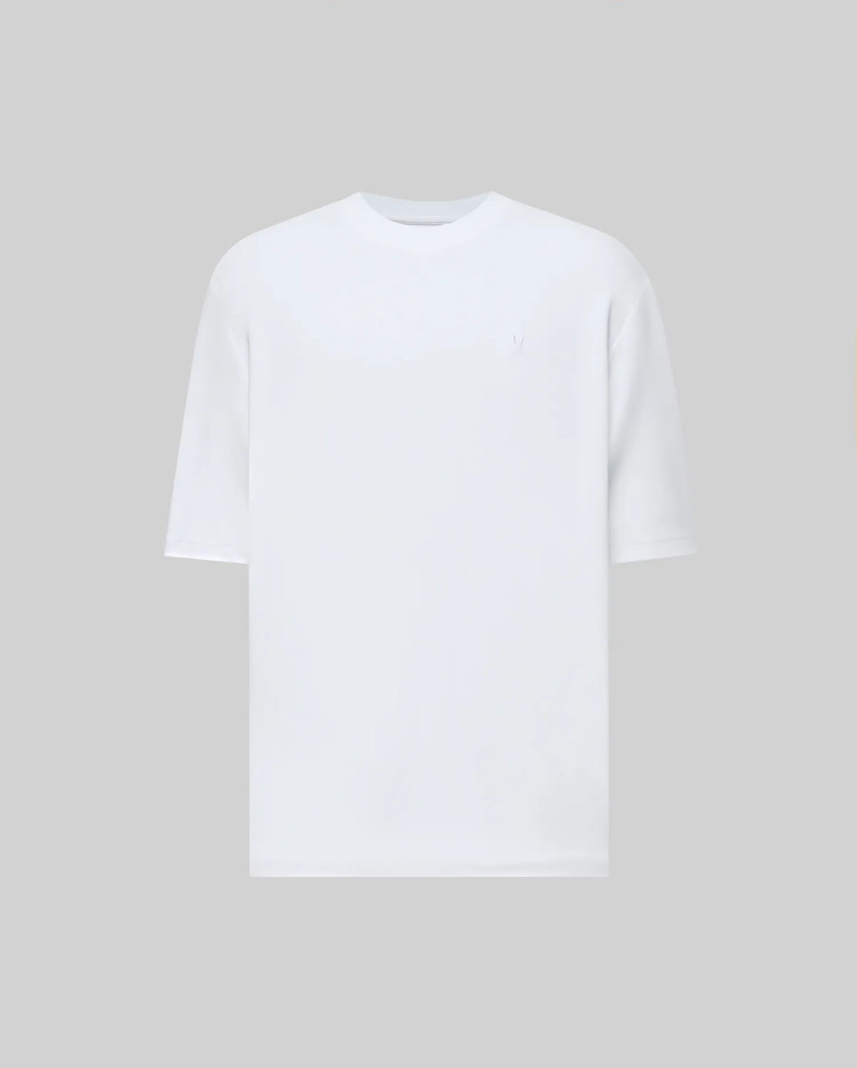 The Psycho Bunny MENS ADAM INTERLOCK TEE (MT0200093) is a plain white men's knit t-shirt with short sleeves, a round neckline, and a subtle embroidered Bunny logo, displayed on a solid light gray background.