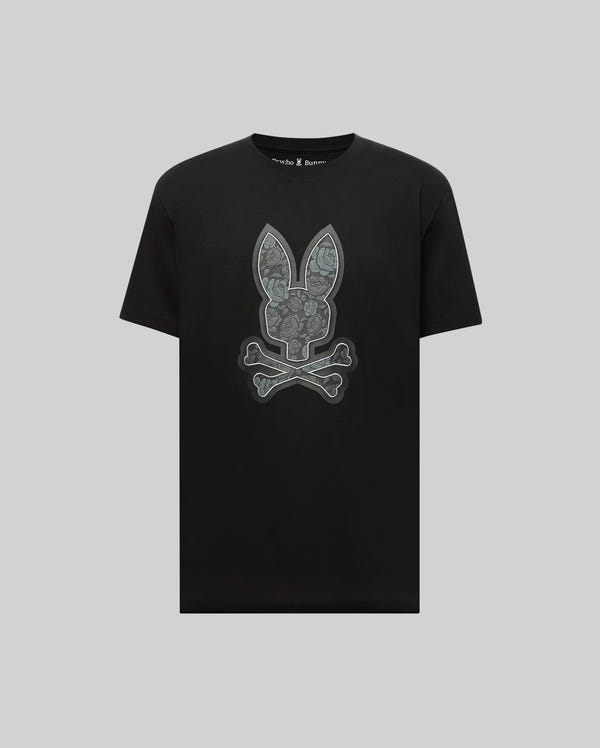 The Psycho Bunny MENS ROWEN BUNNY GRAPHIC TEE - MT0200101 is a black short-sleeve Pima cotton shirt featuring a large gray bunny skull and crossbones graphic on the front.