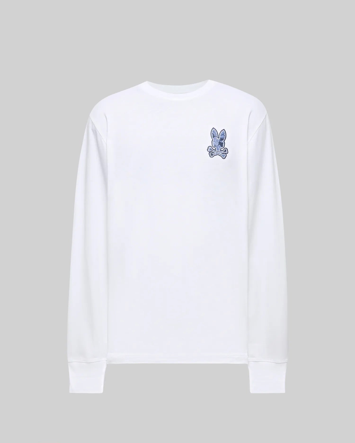 The Psycho Bunny MENS ROWEN GRAPHIC TEE (MT0200103) is a plain white long-sleeve Pima cotton shirt featuring a small blue cartoon bunny logo on the upper left chest, shown against a light gray background.