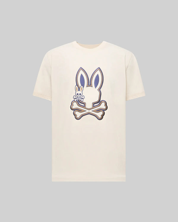 The Psycho Bunny MENS WADE GRAPHIC TEE - MT0200106 is a cream 100% cotton shirt with a bold bunny head and crossed bones graphic on the chest, plus an embroidered Bunny detail inside one ear.
