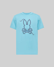 Psycho Bunny MENS CYRUS GRAPHIC TEE (MT0200115) in light blue, made from soft Pima cotton, features a bold stitched bunny head and crossed bones graphic on the front with dashed line accents, set off by a plain gray background.