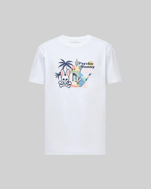 The Psycho Bunny MENS SHANE GRAPHIC TEE (MT0200175) is a white Pima cotton shirt with a colorful chest graphic of a bunny, palm trees, guitar, and “Psycho Bunny” text in tropical style. Displayed on a plain gray background.