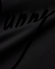 Mens Soren Graphic Tee, a premium black jersey knit t-shirt with a soft drape, featuring a large, subtly textured tonal black script Bunny graphic print, reflecting refined streetwear aesthetics. (6)