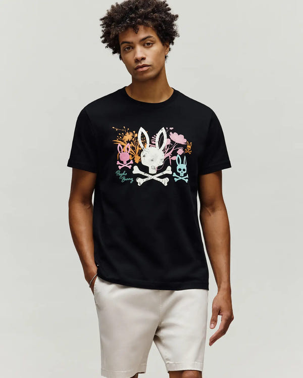 Mens Santino Graphic Tee, black classic fit jersey t-shirt with a large colorful chest graphic featuring a white bunny skull, crossbones, pink, orange, and blue bunny skulls, floral accents, and Psycho Bunny script.