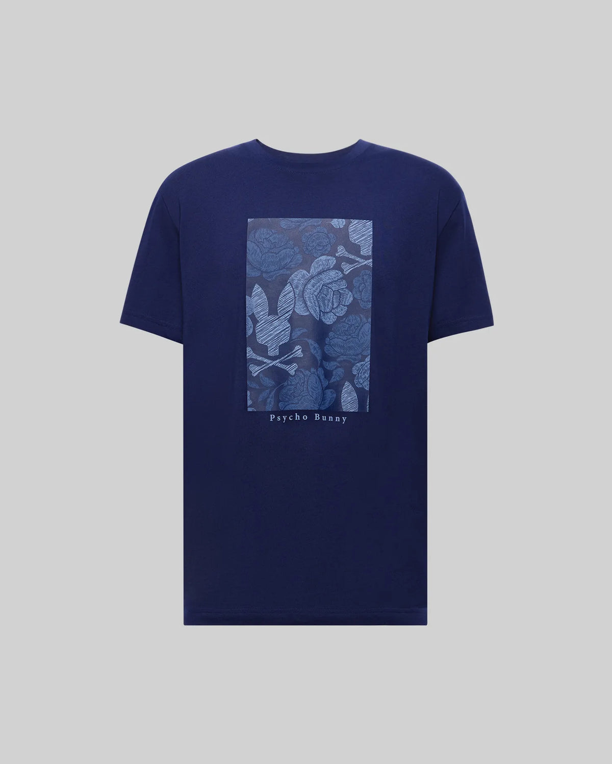 The MENS ROWEN OVERSIZED TEE (MT0200194) by Psycho Bunny is a navy blue Pima cotton shirt with a light blue rectangular floral and leaf graphic on the back, "Psycho Bunny" printed below, and a relaxed, oversized fit for comfort.