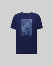 The MENS ROWEN OVERSIZED TEE (MT0200194) by Psycho Bunny is a navy blue Pima cotton shirt with a light blue rectangular floral and leaf graphic on the back, "Psycho Bunny" printed below, and a relaxed, oversized fit for comfort.