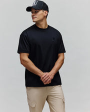 Black Mens Oscar Oversized Tee in smooth jersey knit, featuring a tonal embroidered Psycho Bunny skull logo on the left chest for a relaxed fit.