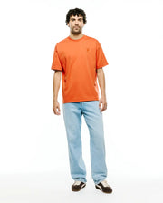 Men's Oscar Oversized Tee, a vibrant orange jersey t-shirt with an oversized fit, featuring a small, tonal embroidered Psycho Bunny skull logo on the left chest. (5)