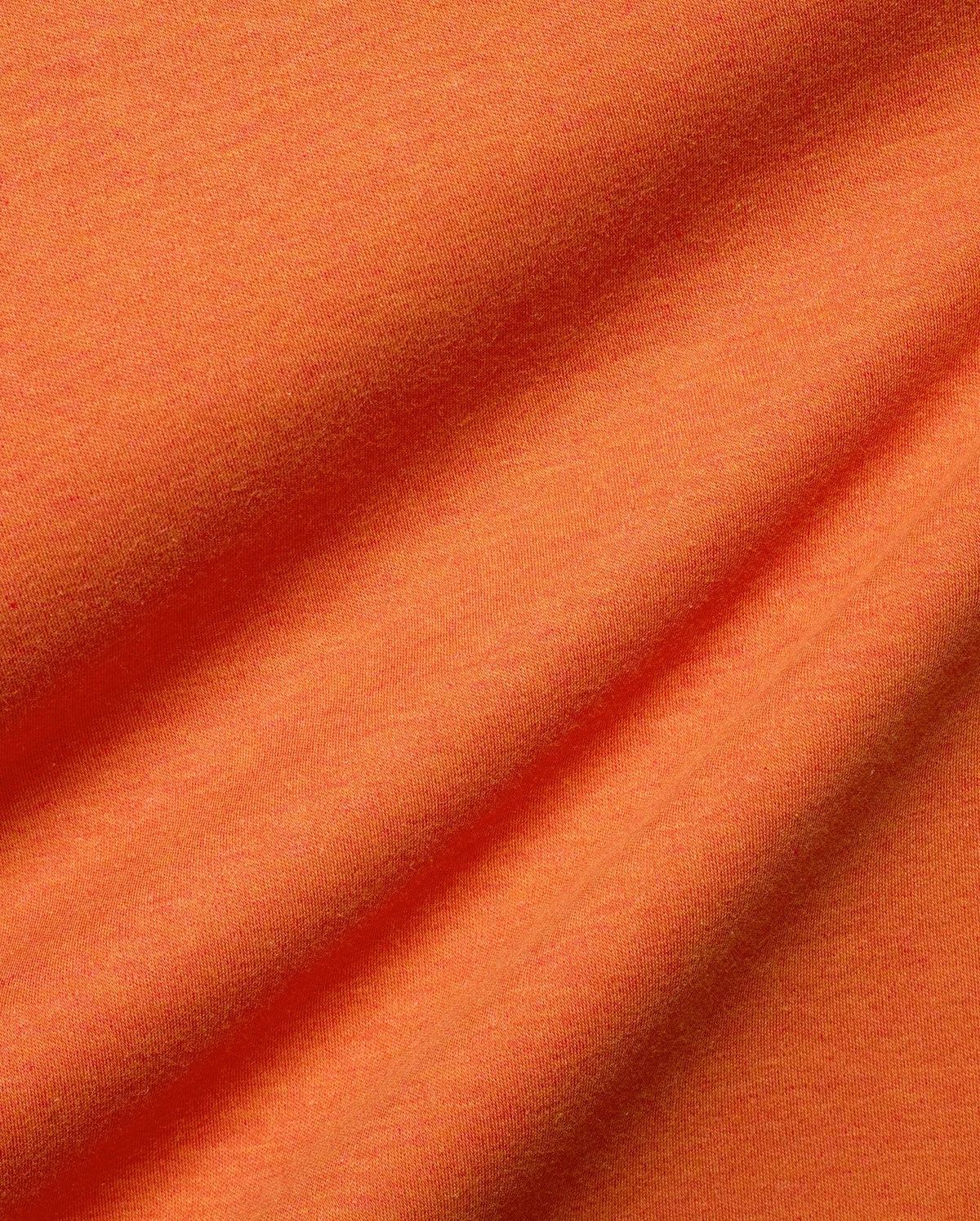 Men's Oscar Oversized Tee, a premium streetwear staple in vibrant heathered orange, crafted from soft jersey knit fabric with natural folds, offering a comfortable, relaxed fit. (7)