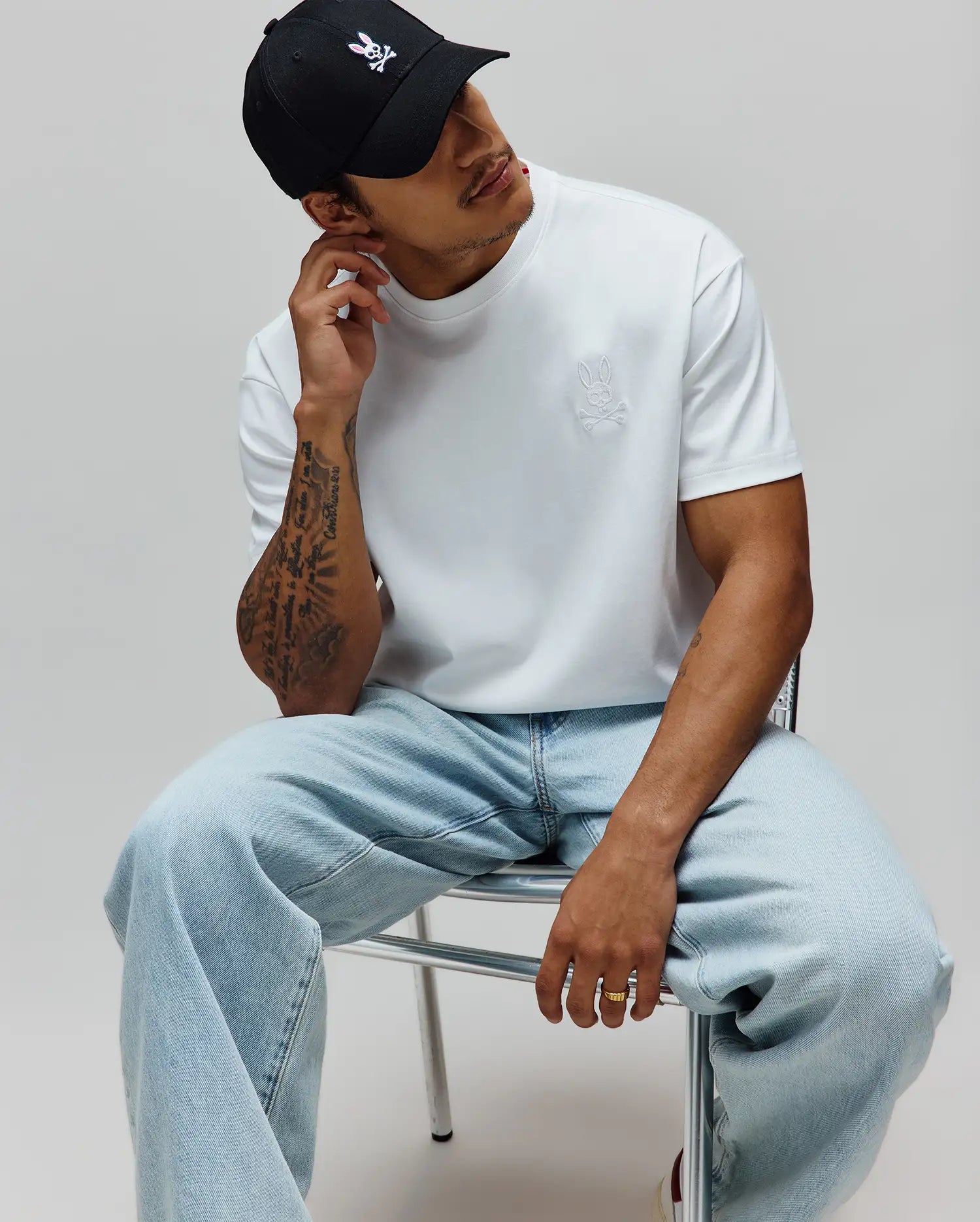 White Mens Oscar Oversized Tee in smooth jersey fabric, featuring a small, tonal embroidered Psycho Bunny skull logo on the left chest for an oversized fit.