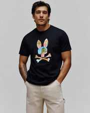 Mens Ara Graphic Tee, black classic fit jersey t-shirt with a large, multi-colored geometric camo Psycho Bunny skull logo graphic on the center chest.
