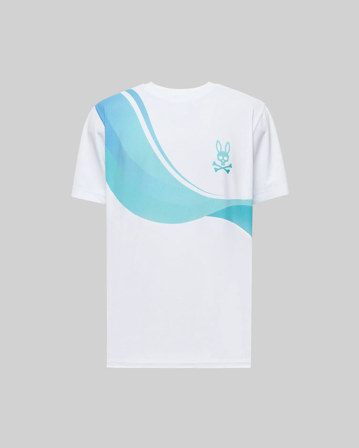 The MENS OFFICIAL US OPEN AVERY NET PERFORMANCE TEE by Psycho Bunny features soft Pima cotton, blue and teal wave patterns on the upper back, and a small blue bunny and crossbones logo on the right shoulder. Displayed on a gray background.