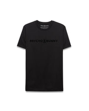 Mens Royce Graphic Tee, a sleek black classic fit jersey t-shirt featuring a prominent tonal black Psycho Bunny text and iconic skull logo graphic centered on the chest. (1)
