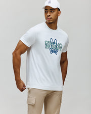 Mens Herman Graphic Tee, white classic fit jersey knit with a large distressed blue and green Psycho Bunny text and skull logo graphic on the chest.