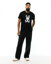 Mens Emmanuel Pima Cotton Graphic Tee, a black classic fit jersey t-shirt featuring a large white Psycho Bunny skull and crossbones graphic prominently centered on the chest. (5)