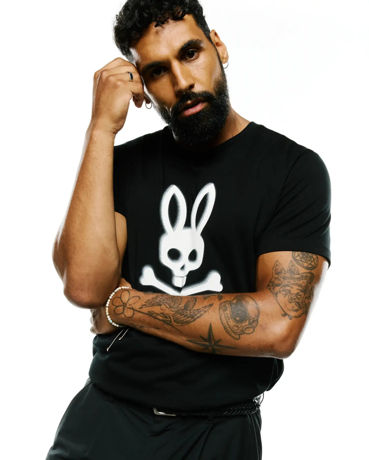 Mens Emmanuel Pima Cotton Graphic Tee, a classic fit black smooth jersey t-shirt featuring a large white Psycho Bunny skull and crossbones graphic centered on the chest. (4)