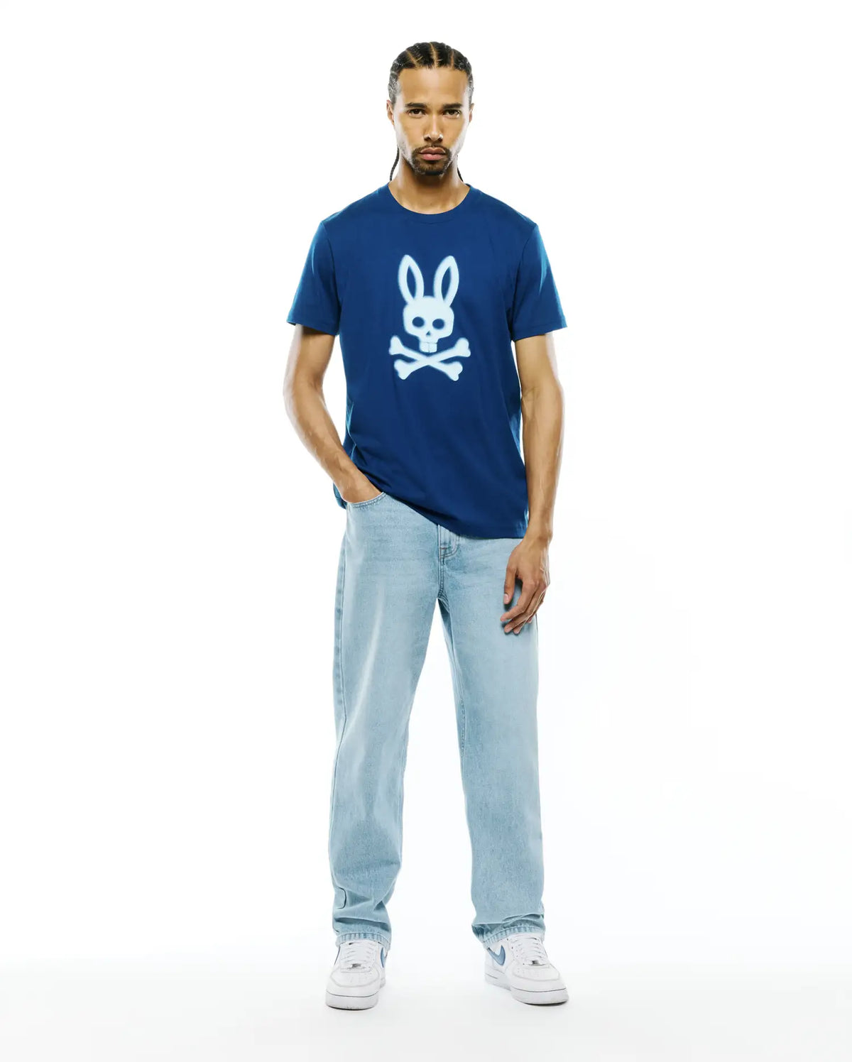 Mens Emmanuel Graphic Tee, a navy blue classic fit jersey t-shirt featuring a large white graphic Psycho Bunny skull logo centered on the chest. (5)