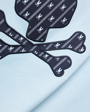 Mens Jaden Graphic Tee in light blue jersey knit, featuring a large navy blue skull and crossbones graphic with white Psycho Bunny logo and checkered stripe pattern, outlined in black embroidery. (6)