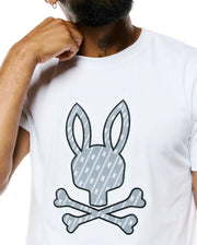 Mens Jaden Appliqué Graphic Tee, white classic fit jersey t-shirt with a large central gray bunny skull logo appliqué, outlined in black, featuring a diagonal stripe pattern and small white bunny skulls. (3)