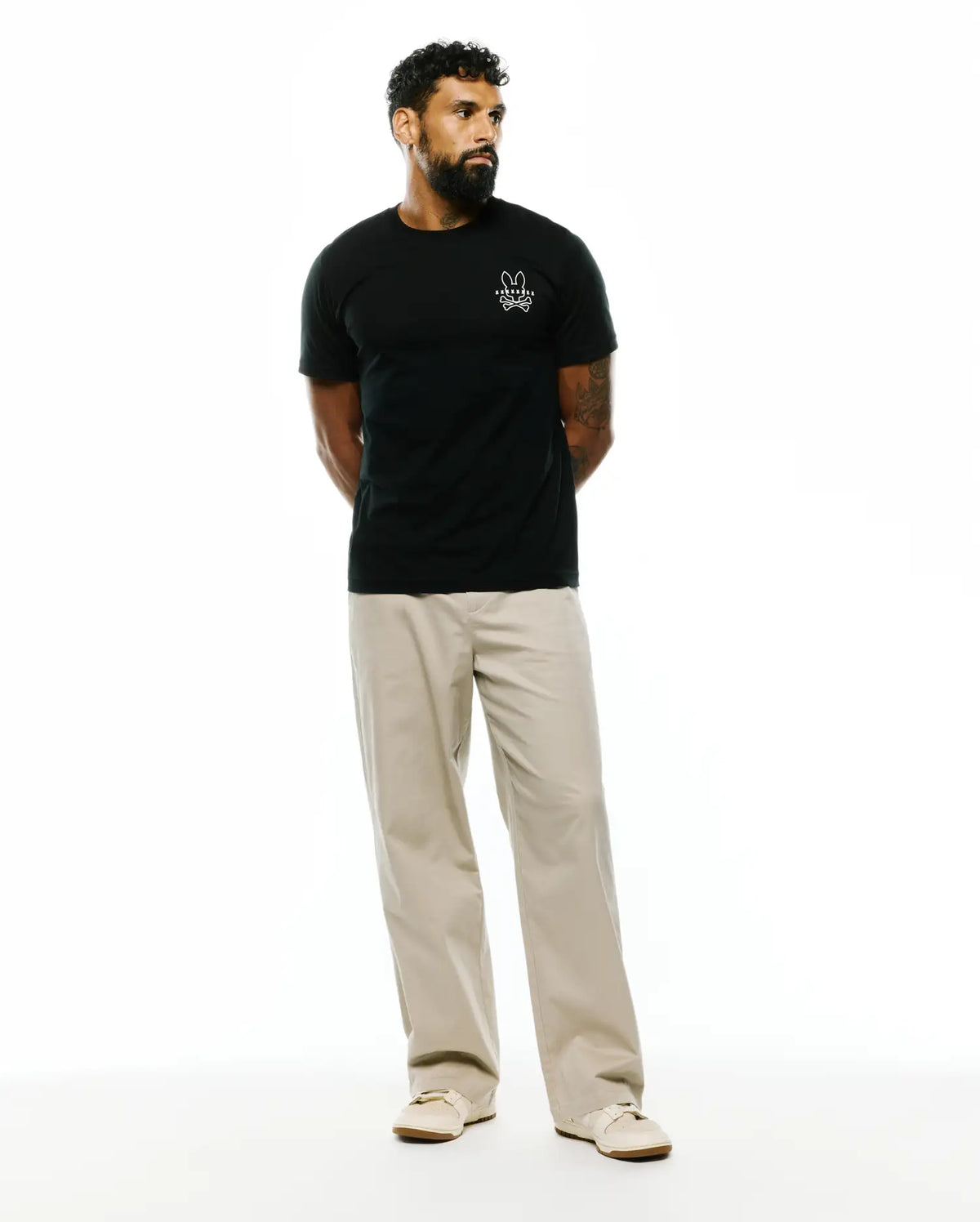 Black Mens Piers Pima Cotton Back Graphic Tee, a classic fit jersey t-shirt with a small white embroidered Psycho Bunny skull logo on the left chest. (4)