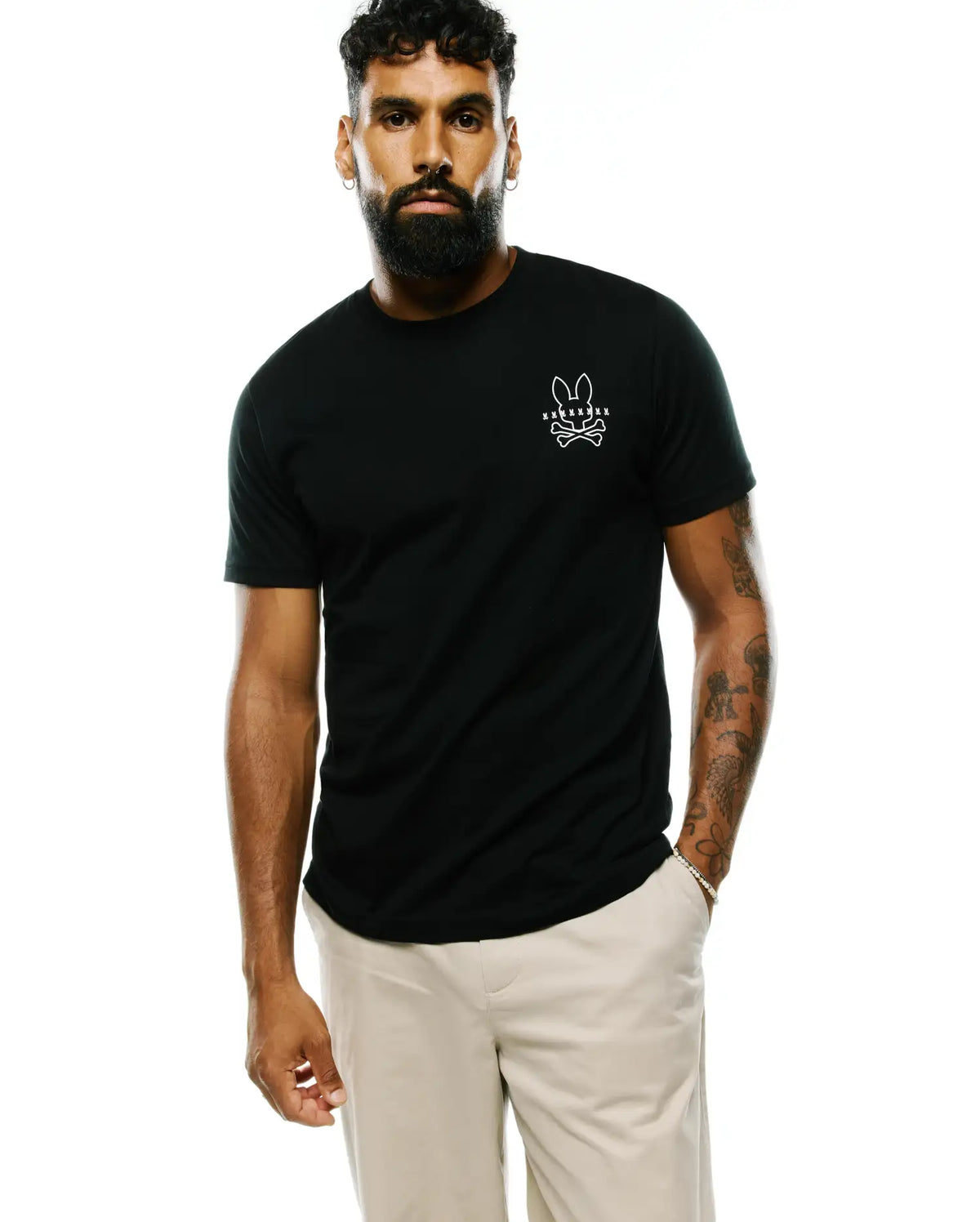 Black classic fit Mens Piers Pima Cotton Back Graphic Tee, crafted from smooth Pima cotton jersey, featuring a small white Psycho Bunny skull and crossbones logo on the left chest. (2)