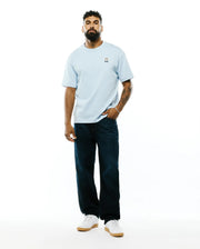 Mens Jaydon Pima Cotton Oversized-Fit Tee in light blue, featuring a soft jersey texture and a small, colorful embroidered Psycho Bunny skull logo on the left chest. (4)