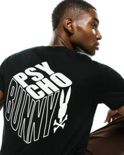 Men's Conan Pima Back Graphic Tee, a black classic fit Pima cotton jersey t-shirt featuring a large white 3D-effect Psycho Bunny text graphic and iconic bunny skull logo on the back. (1)