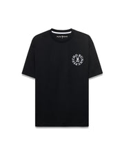 Mens Olek Relaxed Back Graphic Tee, black smooth jersey with a relaxed fit, featuring a white circular Psycho Bunny skull logo graphic on the left chest and white inner neck tape. (5)