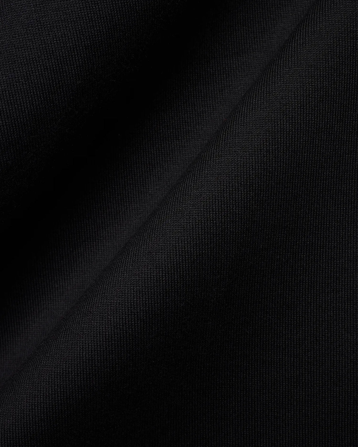 Black MENS OLEK RELAXED BACK GRAPHIC TEE, a premium Psycho Bunny streetwear piece, featuring soft, finely ribbed knit fabric with a subtle sheen, highlighting its luxurious feel and relaxed fit. (6)