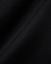 Black MENS OLEK RELAXED BACK GRAPHIC TEE, a premium Psycho Bunny streetwear piece, featuring soft, finely ribbed knit fabric with a subtle sheen, highlighting its luxurious feel and relaxed fit. (6)