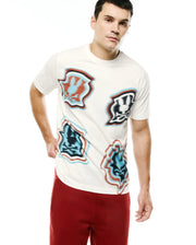 Men's Klaus Jacquard Tee, a cream classic fit jersey t-shirt featuring multiple large, distorted Psycho Bunny skull logos in red, blue, and black jacquard knit. (1)