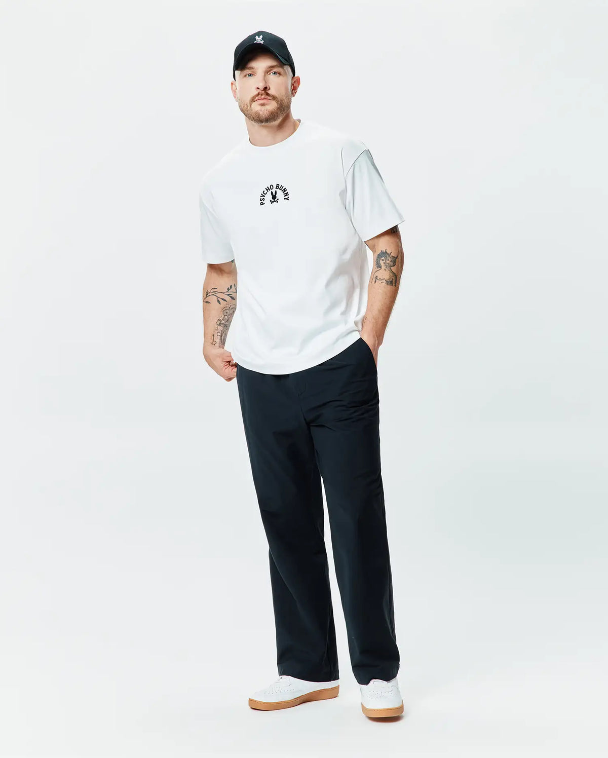 White Mens Stevie Relaxed Fit Tee in smooth jersey, featuring a small, centered black embroidered Psycho Bunny skull logo with curved Psycho Bunny text above it. (4)