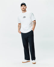 White Mens Stevie Relaxed Fit Tee in smooth jersey, featuring a small, centered black embroidered Psycho Bunny skull logo with curved Psycho Bunny text above it. (4)