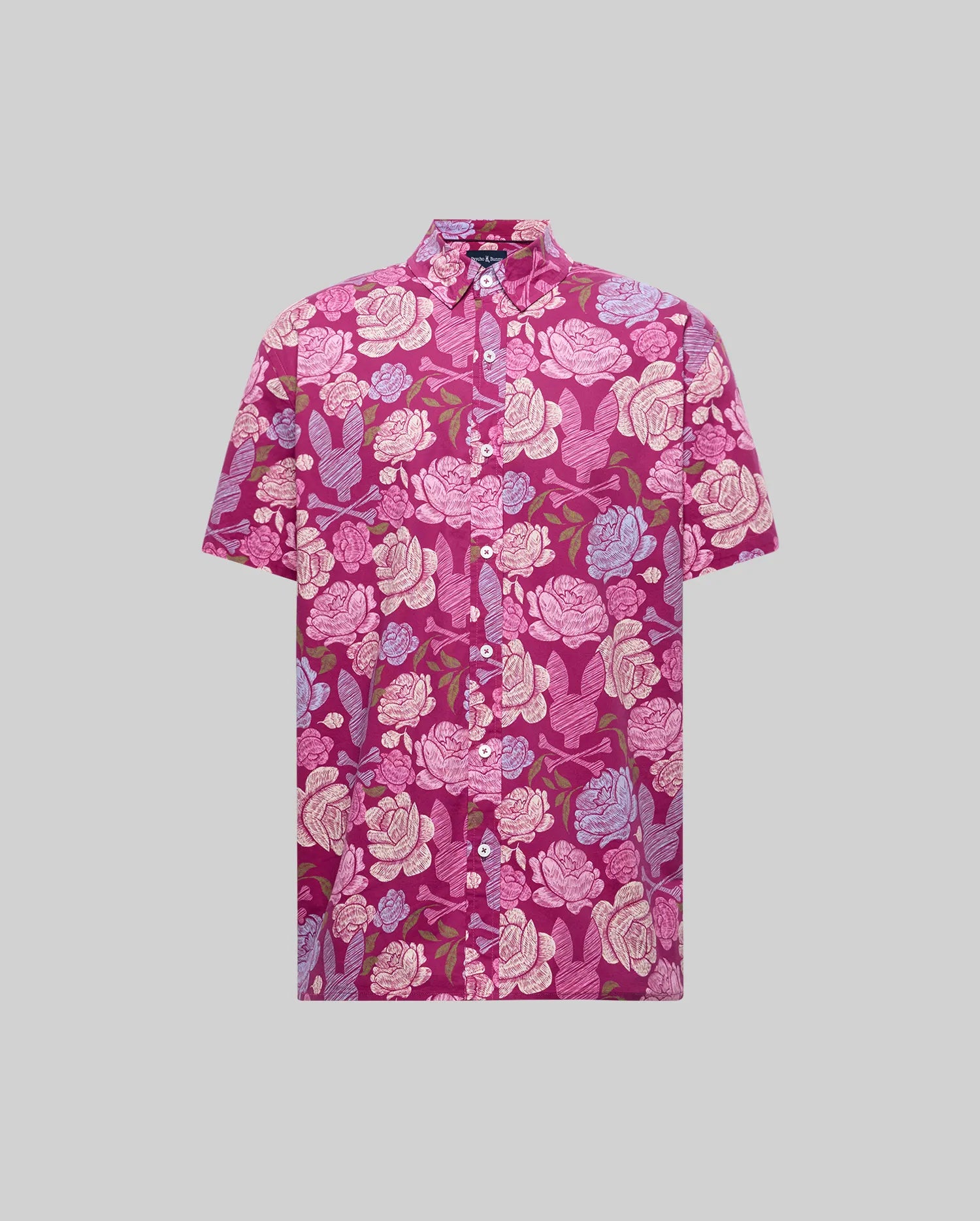The Psycho Bunny MENS ROWEN SHIRT (MT0300038) is a short-sleeved, button-up cotton blend shirt with a pink, purple, and white floral pattern on a magenta background, shown on a plain gray backdrop.