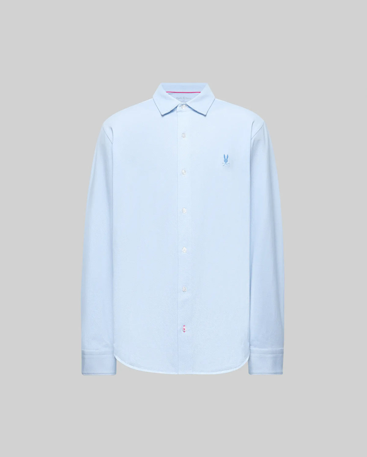 The Psycho Bunny MENS JIM JERSEY STRIPED KNIT SHIRT (MT0300041) is a light blue, long-sleeve pima cotton shirt with a collar and small embroidered blue logo on the left chest, shown against a plain gray background.
