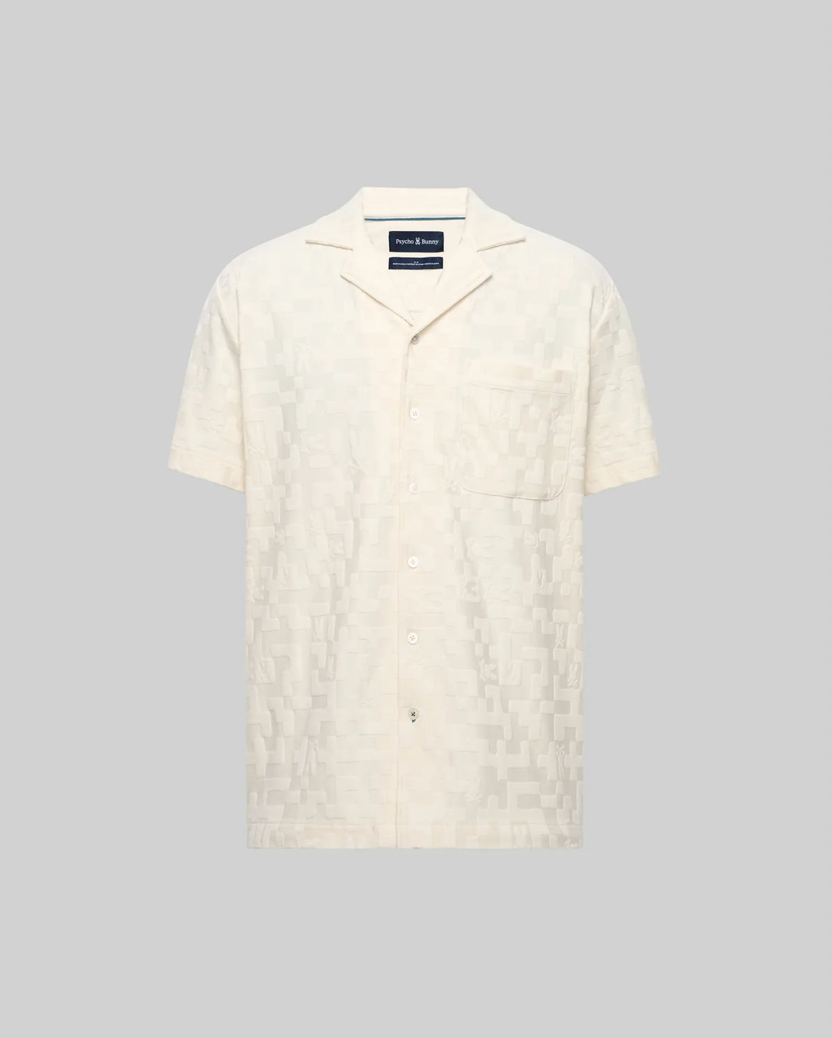 Mens Josh Jacquard Shirt, a cream relaxed fit short-sleeve camp collar shirt featuring a subtle geometric jacquard pattern, full button-front, and a left chest pocket.