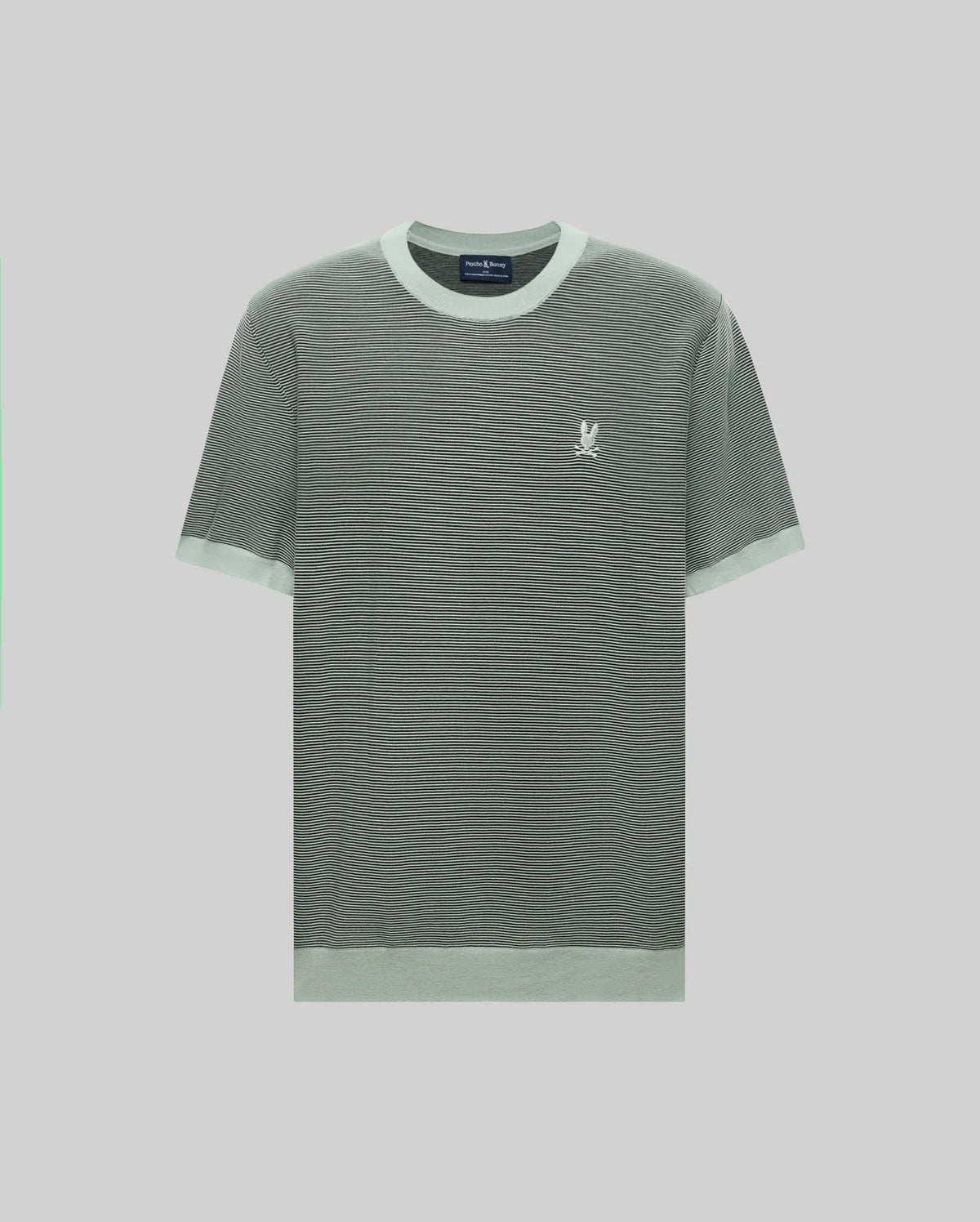The MENS MARIO STRIPED SWEATER T-SHIRT - MT0400009 by Psycho Bunny is a short-sleeved, grayish-green tee with textured stripes, light trim on the collar, sleeves, and hem, and a small white embroidered bunny logo on the left chest. Light gray background.
