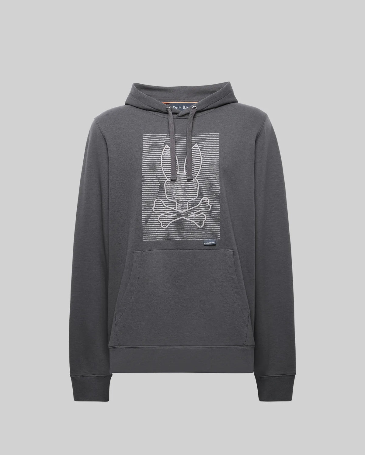 The Psycho Bunny MENS GRANT HOODIE - MT0500032 is a dark gray cotton-blend hoodie featuring a kangaroo pocket and a white horizontal-line bunny skull and crossbones graphic on the chest.