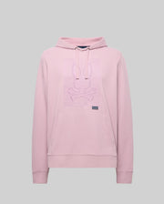 The Psycho Bunny MENS GRANT HOODIE - MT0500032 in light pink is crafted from a premium cotton blend, featuring a kangaroo pocket and a raised bunny head with crossed bones outline graphic on the chest. Background: plain light gray.