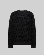 The Psycho Bunny MENS REED FLOCK CREW (MT0500041) is a black cotton crewneck sweatshirt with an allover subtle Bunny pattern and "BB" and "SBY" lettering, shown on a plain grey background.