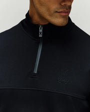 Mens Zeke 1/4 Mock Zip Pullover in black, classic fit, smooth fabric, dark grey 1/4 zip with Psycho Bunny logo pull, horizontal chest seam, and tonal embroidered bunny skull on left chest.