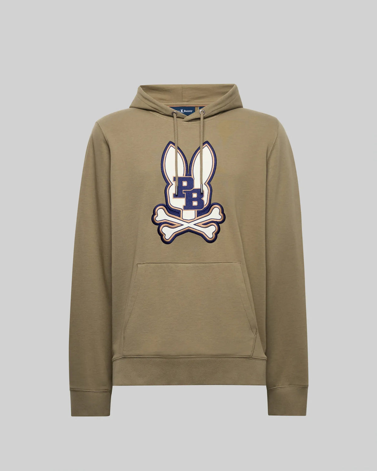 The Psycho Bunny MENS WADE HOODIE - MT0500112 is a khaki cotton-blend hoodie with white bunny ears graphic, an embroidered navy "PB" Bunny patch, white crossed bones on the chest, front pocket, and drawstrings.