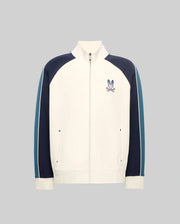 Cream classic fit Mens Caspian Track Bomber with navy and teal color block raglan sleeves, white stripe detail, ribbed cuffs/hem, and embroidered Psycho Bunny skull logo on left chest.