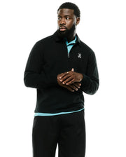 Men's Samson Quarter-Zip Sweater in black, featuring a classic fit, smooth knit fabric, a collared neckline with a silver quarter-zip closure, and a small white embroidered Psycho Bunny skull logo on the left chest. (2)