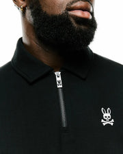 Men's Samson Quarter-Zip Sweater in black smooth jersey knit, featuring a collared neck, silver quarter-zip with a Psycho Bunny logo pull, and a small white embroidered bunny skull logo on the left chest. (3)