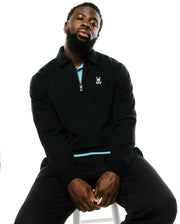 Black classic fit Men's Samson Quarter-Zip Sweater in a smooth knit, featuring a light blue inner collar, quarter-zip with logo pull, and small white embroidered Psycho Bunny skull on the left chest. (4)